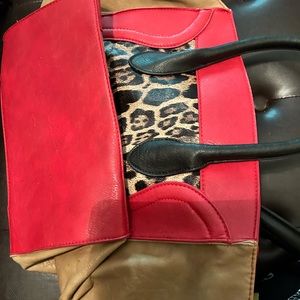 Beautiful Yoki bag, NWOT. No marks or scratches. Red/brown/leopard. Large